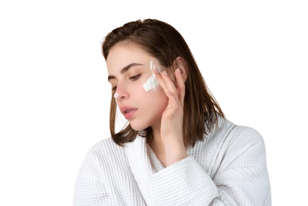 woman puting a cream on thire face